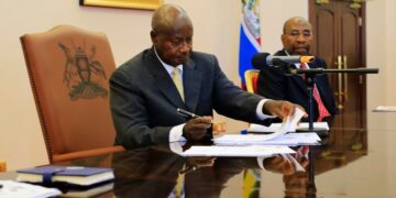 President Museveni  signs  four (4) bills into law